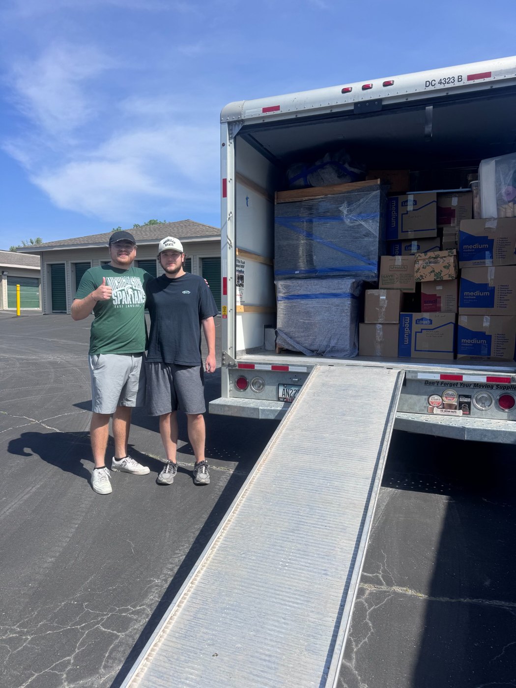 The Garage Sweepers helping load a U-Haul for a storage unit job